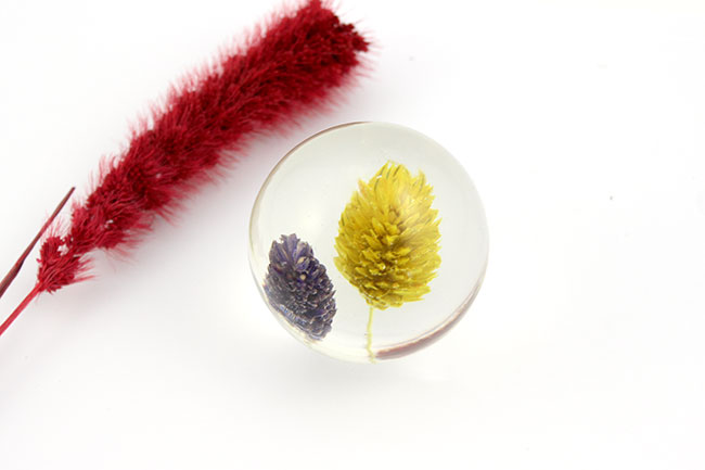 Resin paper-press ball with dried flower inclusion Resin paper-press ball with dried flower inclusion