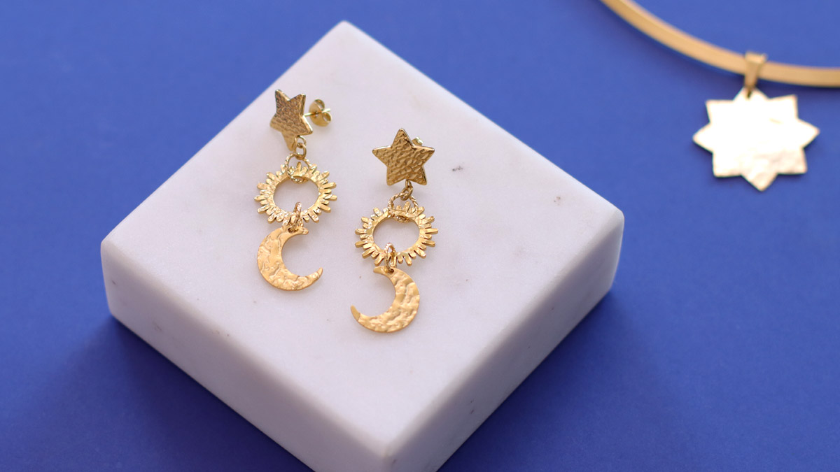 Gold Tone stainless steel earrings with sun and moon star motif Gold Tone stainless steel earrings with sun and moon star motif