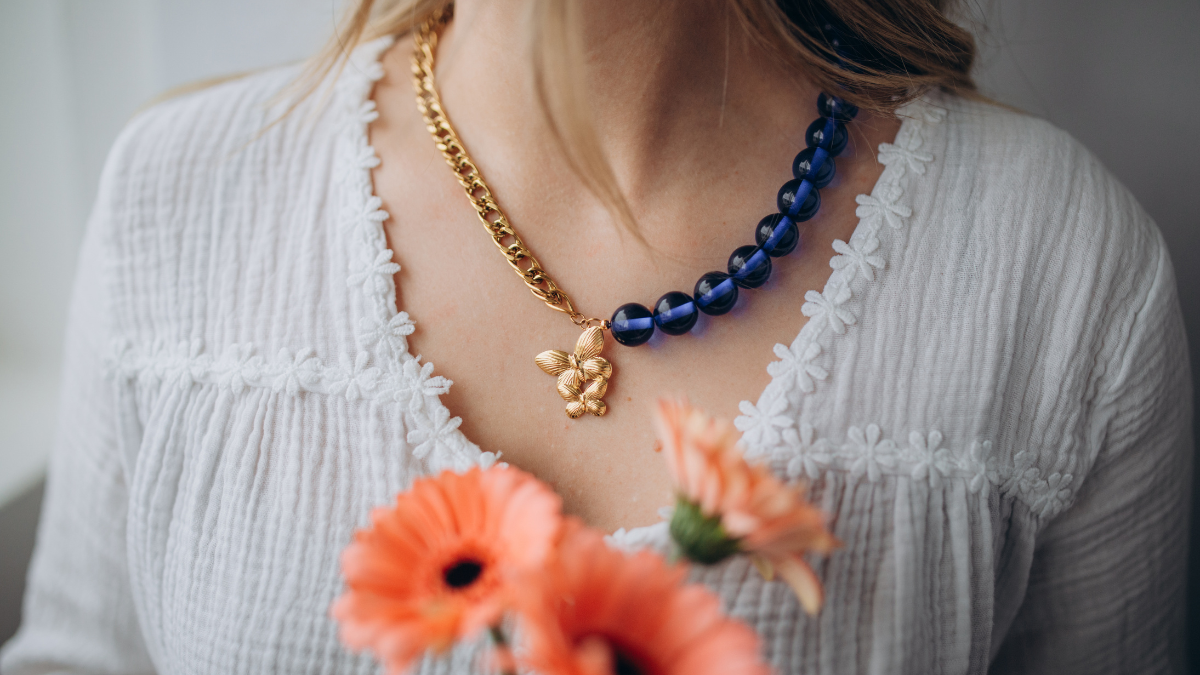 Necklace with large beads and butterfly pendant Necklace with large beads and butterfly pendant