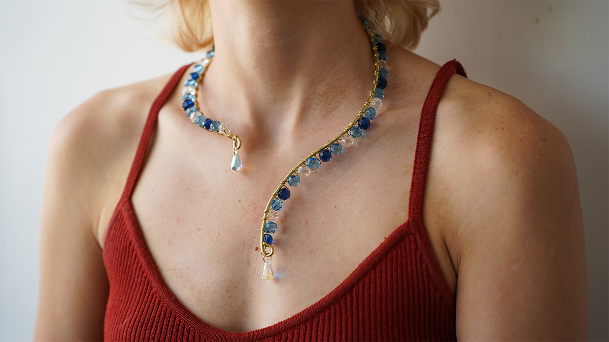 Brass wire necklace with blue beads and PureCrystal drops Brass wire necklace with blue beads and PureCrystal drops