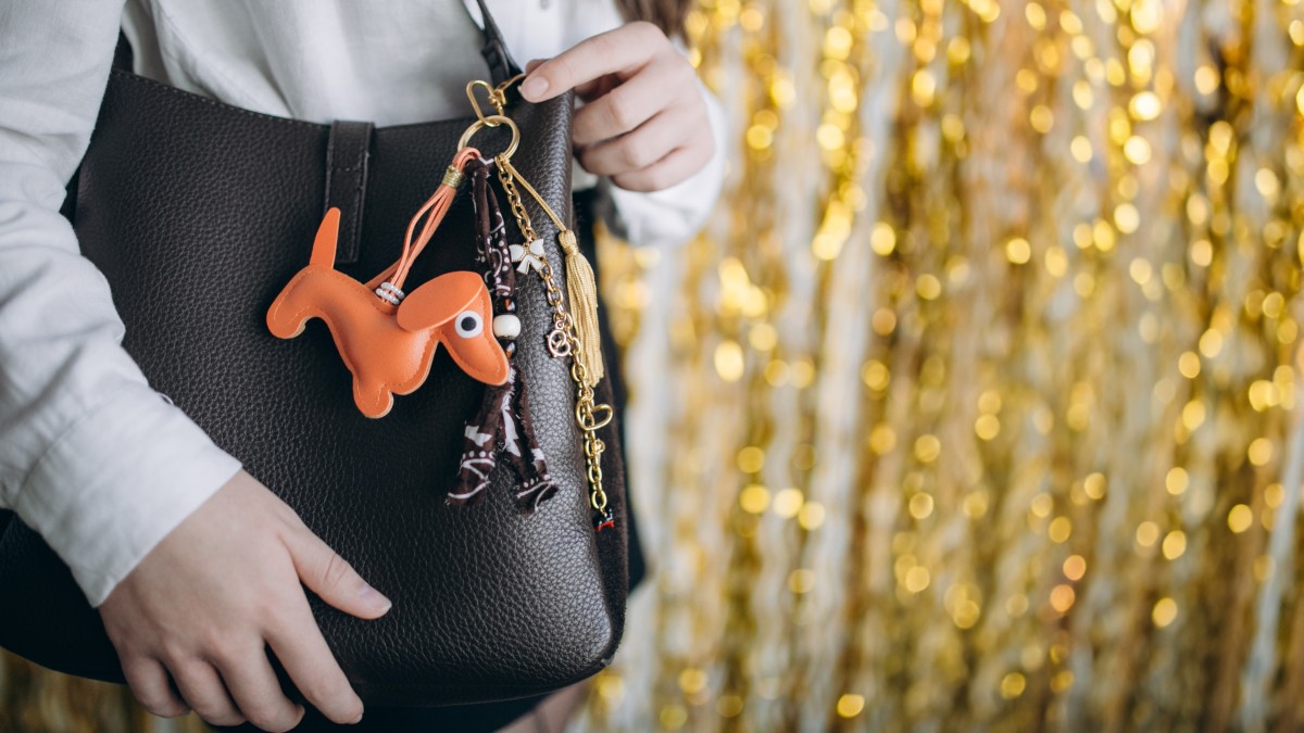 Bag jewel with dachshund pendant, pompoms and bandana Bag jewel with dachshund pendant, pompoms and bandana