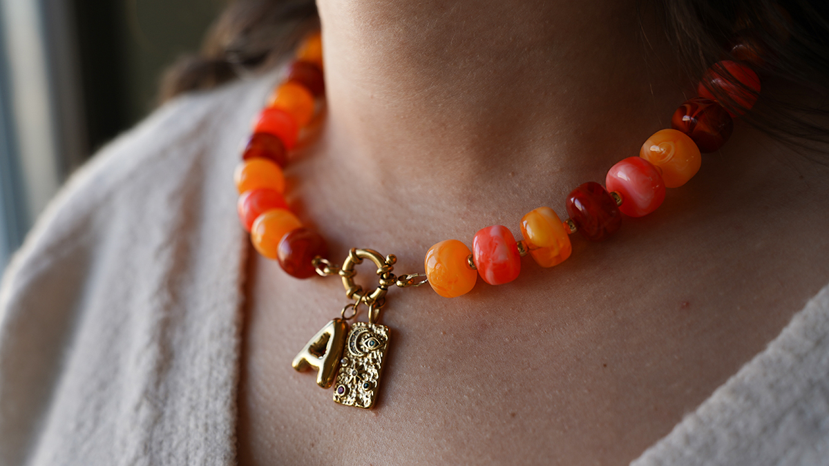 Necklace with large colored acrylic beads and letter pendant Necklace with large colored acrylic beads and letter pendant