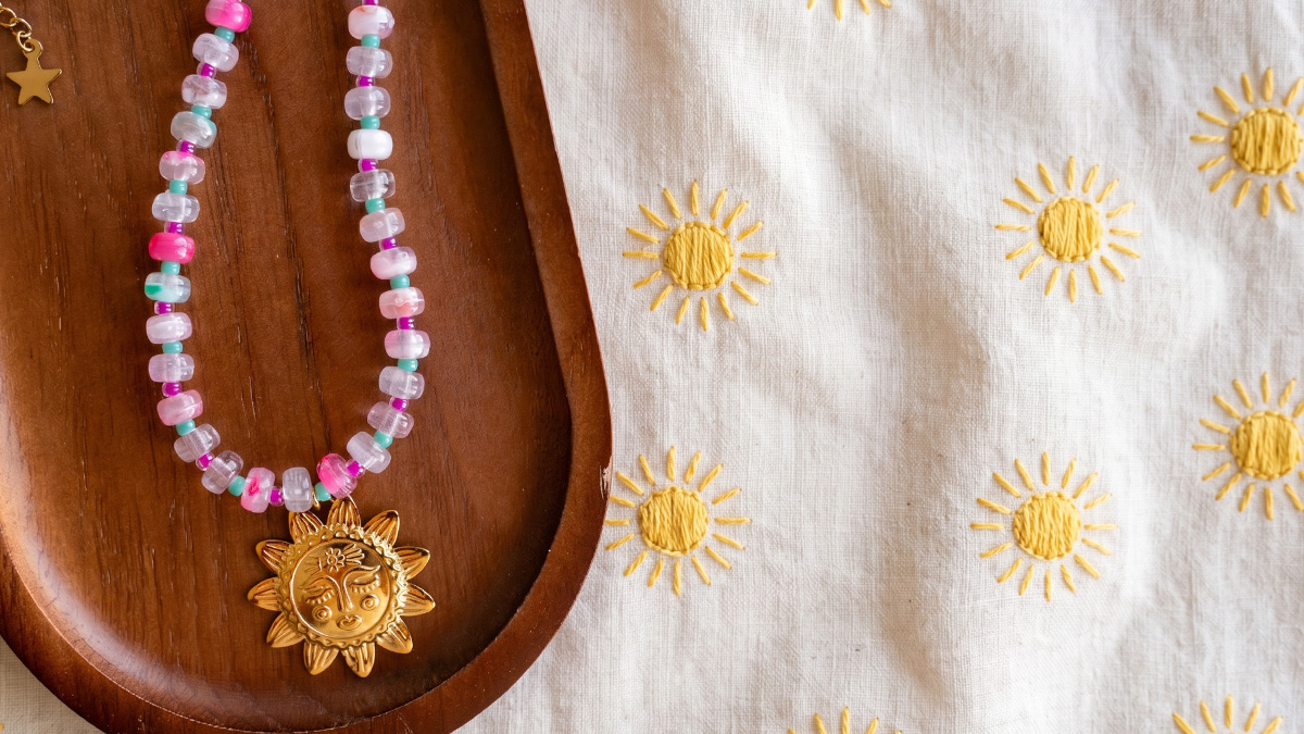 Resin rondelle beads necklace with sun pendant Resin rondelle beads necklace with sun pendant